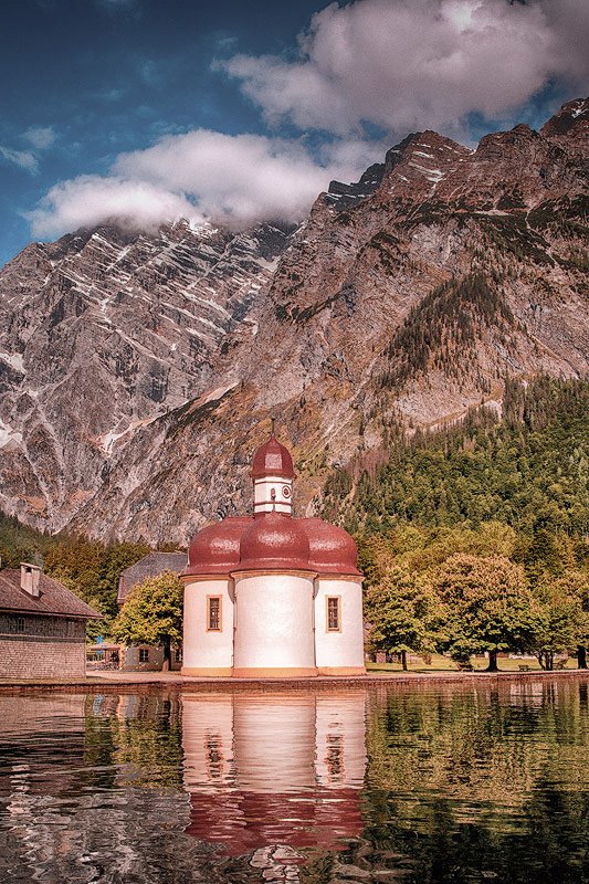 St. Bartholomew’s Church on the shores of Königssee, surrounded by the Bavarian Alps in Germany.